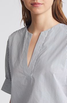 Elbow-length sleeves frame this organic-cotton poplin blouse covered in stripes and topped with a classic split neckline. 24 1/2" length (size Medium) Split neck Elbow-length sleeves 100% organic cotton Dry clean or machine wash, dry flat Imported Striped Cotton V-neck Blouse, Classic V-neck Top With Striped Collar, Cotton V-neck Top With Striped Collar, Cotton Tops With Vertical Stripes For Daywear, Chic Striped Tops For Daywear, Spring Office Tops With Striped Collar, Summer Cotton Blouse With Striped Sleeves, Elegant Striped Relaxed Fit Tops, Elegant Striped Cotton Tops