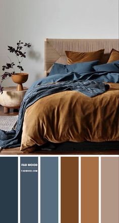 a bedroom with brown and blue colors in the bedding, pillows and blankets on it