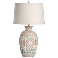 a ceramic lamp with a white shade on the base and a blue geometric pattern design