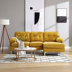 a living room with yellow couches and white rugs