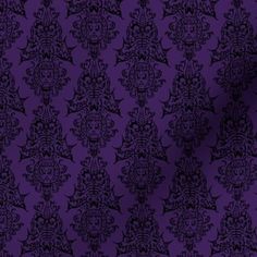 purple and black wallpaper with an intricate design on it's surface, as well as the background