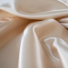 Designer dead stock fabric in a silky champagne polyester charmeuse. Canadian designer. Elegant Cream Silk Satin Dress, Elegant Cream Satin Dress, Formal Cream Silk Satin Dress, Beige Silk Satin Party Dress, Beige Silk Satin Dress For Party, Beige Silk Satin Evening Dress, Beige Satin Dress For Evening, Beige Satin Evening Dress, Champagne Colour