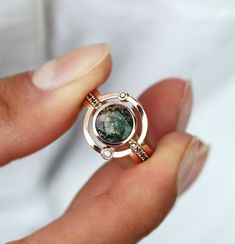 Alternative matching 14k/ 18k gold ring set. A stunning statement piece, unique design by Capucinne.
For the moss agate set, please select your stone from this picture.
Details Upper curved band Gemstone: white diamond Shape: round Measurements: approx. 1.5 mm Weight: approx. 0.015 ct
Middle ring Main stone: black diamond (or black onyx) / rutile quartz / moss agate Shape: round Measurements: approx. 7.5-8 mm Weight: approx. 2 ct Band stones: black diamonds (12) Measurements: approx. 1.1 mm Tota Luxury Spiritual Agate Rings, Saturn Ring, Gold Dainty Ring, Planet Ring, Unique Engagement Ring Settings, Celestial Ring, Agate Engagement Ring, Moss Agate Ring, Black Quartz