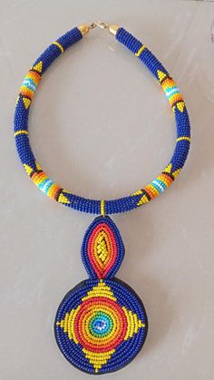 Blue African Beaded Pendant Necklace Zulu Necklace African | Etsy Traditional Hand-strung Blue Jewelry, Traditional Blue Beaded Necklaces, Bohemian Blue Necklace With Black Beads, Traditional Blue Beaded Choker, Blue Necklaces With Large Beads For Gift, Traditional Blue Beaded Necklace, Traditional Hand-strung Blue Necklace, Traditional Blue Handmade Choker, Yellow Necklace With Round Black Beads