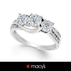 three stone engagement ring with diamonds on the sides and an inscription that says macy's