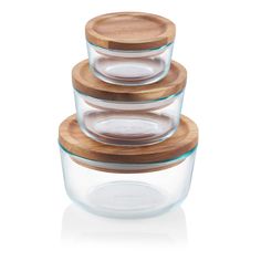 stack of glass containers with wooden lids