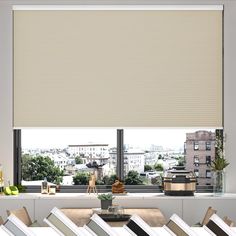 a window with blinds in front of it and the view out to the city outside