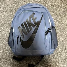 Blue Nike Backpack With Straps And Water Bottle Holder Cheap Nike Nylon Backpack, Cheap Nike Standard Backpack, Cheap Everyday Nike Backpack, Cheap Nike Black Backpack, Cheap Black Nike Backpack, Nike Tanjun Premium Backpack, Nike Backpack For Travel And Back To School, Nike Standard Backpack With Zipper Closure, Nike Standard Backpack