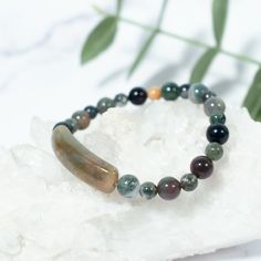 This beaded bracelet is made of natural Indian Agate Gemstone, which is great for bringing you confidence, physical strength, and emotional security. Our Gemstone Beaded Bracelets are designed to feel lightweight, comfortable, and effortless.Stringing each natural stone is part of our mindful Intention when we create this beaded bracelet, infusing positive energies, love, and happiness within each design.We combine meaningful symbols and natural gemstones giving this one accessory relevance in e Jade Crystal Bracelet With Natural Stones For Meditation, Healing Jade Crystal Bracelet With Natural Stones, Agate Bracelets With Natural Stones For Meditation, Agate Natural Stone Bracelets For Meditation, Hand-strung Agate Beaded Bracelets For Healing, Hand-strung Agate Stretch Bracelet For Meditation, Agate Beaded Bracelets For Healing, Healing Agate Beaded Bracelets, Spiritual Agate Beaded Bracelets For Healing