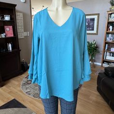 Zenana Blue 3/4 Large Double Ruffle Sleeves Vneck Blouse. Beautiful. Brand New With Tag Still Attached. Size M. Armpit To Armpit Is 20 Inches, Length Is 27 Inches. Says It’s A Size L, But Measurements Say It’s A Size M. Material Is 100% Polyester. Chic Blue V-neck Top For Spring, Blue V-neck Blouse For Fall, Blue Flowy V-neck Top, Blue V-neck Blouse For Brunch, Blue Ruffle Sleeve Tops For Fall, Elegant Blue Blouse With 3/4 Sleeves, Chic Blue Tops With 3/4 Sleeve, Blue Bell Sleeve Top For Fall, Flowy Tunic Tops