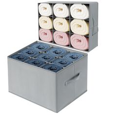 an open storage box filled with rolled up towels