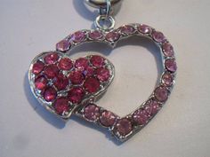 Pink double heart necklace. It measures approx. 19 inches and has a toggle clasp closure. Made with a light pink rhinestone heart silhouette and a smaller solid hot pink rhinestone heart. Silver tone. Perfect for give or wear on Valentine's Day. All sales are final and as is. Thank you for looking. You may also love this: https://www.etsy.com/listing/584789387/heart-silhouette-pendant-necklace?ref=shop_home_active_1 Valentines Day Costume, Pink Heart Pendant, Heart Silhouette, Double Heart Necklace, Carnelian Ring, Rhinestone Heart, Double Heart, Lovely Necklace, Lovely Earrings