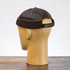 Simple, sturdy and warm docker style cap made with genuine leather. Its cut is above ears. Genuine leather and cotton lining offers a great wearing comfort and good breathability. It has an opening and a velcro strap in the back. The main advantage of this cap is it's material - high quality leather and cotton lining. Cap is very comfortable to wear and has a nice look. Velcro strap on the back of crown helps to adjust the cap properly. The crown of cap is finished with ribbing. This cap is avai Brimmed Brown Beanie For Outdoor, Leather Winter Hat With Flat Bill, Leather Cap For Streetwear, Brown Leather Cap, Dock Worker, Docker Hat, Retro Motorcycle, Sun Protection Hat, Winter Socks