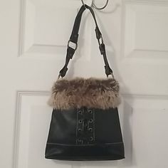 Nwot Faux Leather With Fur Trim Purse In Excellent Condition. Brass Accented Hoop Hardware. Front Has Crisscross Tie Design. Single Strap. Interior Has Zippered Pocket. Measurements Are Approximately 9"L X 8"H X 2 1/2"W. Leather Bag With Faux Fur Lining, Winter Leather Shoulder Bag For Shopping, Brown Leather Bag With Faux Fur Lining, Winter Leather Shoulder Bag With Faux Fur Lining, Leather Bags With Faux Fur Trim For Everyday Use, Fur Purse, Tie Design, Brass Accents, Fur Trim