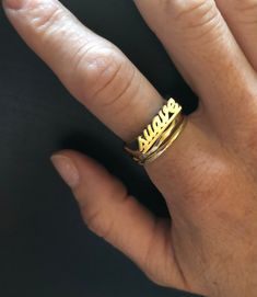 "Have a little fun and take your bling to another level with the Suave word ring. Stack it with other smaller rings. Pair it with other word rings like this one: https://www.etsy.com/listing/1063378702/rico-word-ring-rico-rich-word-ring?ref=shop_home_active_1&frs=1 word length: 16mm word height: 3 mm word width: 4 mm shank width: 1.5 mm This ring can be cast in brass, silver, or 14k gold plated over silver. If you are interested in solid gold please message me and we can discuss pricing. Love it Jewelry Latina, Word Rings, Nameplate Ring, Latina Jewelry, Word Ring, Spanish Words, Ring Stack, Small Rings, Ring Gold