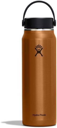 the hydro flask water bottle has a black lid and is in an orange color