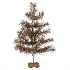 a small silver christmas tree with red berries on it's branches and a wooden base