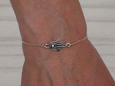 925 Sterling silver Hamsa hand bracelet. L e n g t h:  6.3" + 0.98" extension chain (16 cm. + 2,5 cm). Hamsa hand dimensions: 0.79" x 0.43" (2 x 1,1 cm) Shipping: By Postal Service (no tracking). If you need tracking please choose another shipping option when you order it. 925 Sterling silver chain, components and finding. To see other models https://www.etsy.com/es/shop/Malukart Sterling Silver Dangle Chain Bracelet Gift, Adjustable Silver Chain Bracelet With Spiritual Style, Adjustable Silver Chain Bracelet, Spiritual Style, Adjustable Silver Spiritual Chain Bracelet, Adjustable Silver Chain Charm Bracelet, Sterling Silver Dangle Bracelets With Adjustable Chain, Sterling Silver Spiritual Dangle Bracelets, Spiritual Sterling Silver Dangle Bracelets, Hamsa Bracelet