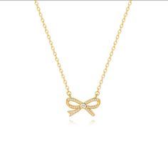 NECK JEWELRY: Featuring a 20mm long * 12mm wide cubic zirconia pave bow pendant, the simple everyday necklace is minimal and lightweight. This CZ bowtie charm necklace sparkles in the light and is very beautiful.The total length of the bow necklace is 16"~18", so you can adjust it to fit your neck size or layer it with other gold chokers for women.  TRENDY JEWELRY: The sweet cute necklace is designed with the most fashionable element of the moment - a bow. The bohemian necklace is simple and is easy to match clothes. Adopting 18k gold plated material, the gold bow choker will not fade easily. CHIC JEWELRY: The bowknot pendant necklace is handcrafted by skilled workers. The cubic zirconia bow necklace ensures that the cubic zirconias are firmly fixed on the pendant by using advanced micro-i Gold Cubic Zirconia Necklace With Clavicle Chain, Gold Rhinestone Clavicle Chain Necklace For Formal Occasions, Formal Cubic Zirconia Pendant Chain Necklace, Gold Plated Necklaces With Pave Setting For Gift, Formal Gold Rhinestone Clavicle Necklace, Gold Plated Pave Setting Necklace For Gift, Adjustable Chain Cubic Zirconia Necklace For Anniversary, Cubic Zirconia Adjustable Chain Necklace For Anniversary, Formal Diamond Charm Necklace