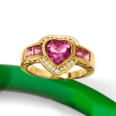 Ross-Simons - 3.20ct t. w. Pink Topaz, .18ct t. w. Diamond Heart Ring Over Sterling. Size 9. Stand out on date night with our glitzy ring! It flaunts a radiant 2.00 carat heart-shaped pink topaz accentuated by a sparkly halo of .18 ct. t. w. round diamonds and additional 1.20 ct. t. w. square pink topaz gems trailing either side. Crafted in 18kt yellow gold over sterling silver. 1/2" wide. Diamond and pink topaz heart ring. On Date, Diamond Heart Ring, When I Get Married, Pink Topaz, I Got Married, Pink Ring, Diamond Heart, Round Diamonds, Unique Pieces