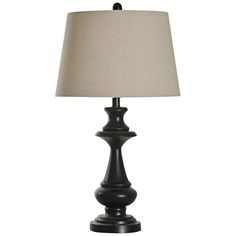 a black table lamp with a white shade on the base and a beige linen shade on the top