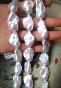 AA White Baroque Pearls, Freshwater Large Baroque Pearl Beads in 15-20x16-40mm, Fireball Pearls, Real Pearls in Full Strand PB1714 Material genuine freshwater pearl, fully drilled Qty 1 strand/PKG, 14 inches around Color white Size 15-20x16-40mm It is estimated good luster More quantity? Wholesale price? Convo us! Mermaid Halloween Outfit, White Baroque Pearl Necklace, Large Pearl Necklace, Chunky Pearl Necklace, Mermaid Halloween, Chunky Pearls, Pearl Gifts, Pearl Necklace Designs, Real Pearls