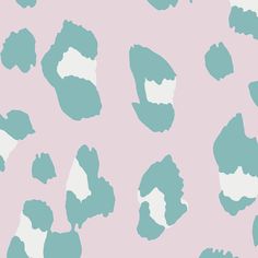 a pink and blue animal print wallpaper with white spots on the bottom half of it