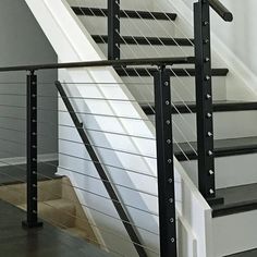 the stair railings are black and white in color