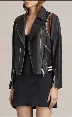 Multiple zip pockets and a contrasting trim on the shoulders and hem add edgy styling to this signature asymmetrical zip front leather jacket - Notch collar - Long sleeves - Front zip closure - Front zip pockets - Leather construction - Rib trim - Imported Fiber content: Shell: 100% lamb leather Body Lining: 62% viscose, 38% cotton Sleeve Lining: 100% polyester Rib: 82% acrylic, 17% cotton, 1% elastane Allsaints Leather Biker Jacket, Allsaints Biker Jacket For Fall, Allsaints Biker Leather Jacket For Fall, Allsaints Leather Biker Outerwear, Allsaints Biker Leather Jacket, Allsaints Long Sleeve Biker Leather Jacket, Allsaints Black Leather Jacket For Fall, Allsaints Black Outerwear For Work, Allsaints Black Leather Jacket Long Sleeve