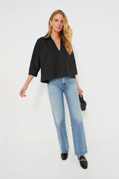 The Pomander Place line is made up of colorful, classic pieces that blend our favorite traditional design elements with playful details.Classic, sleek, and effortless, the Black Polo Popover is the easy style that we know will live in your closet for years to come. Featuring a slightly cropped boxy silhouette, flattering collared V-neck, and three-quarter length batwing sleeves, this sophisticated number is perfect for an elevated daytime look or for cocktail hour. We are pairing it with denim o Effortless Black Top For Spring, Effortless Black Tops For Spring, Black Versatile Blouse With Relaxed Fit, Modern Black Blouse For Spring, Modern Black Cotton Blouse, Modern Everyday Blouse For Fall, Modern Black Spring Blouse, Versatile Everyday Black Blouse, Black Relaxed Fit Blouse For Everyday