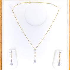 This Elongated Drop Diamond + 18k Gold Set, weighing 8.8 grams, is a striking example of sophisticated design and luxurious craftsmanship. Crafted in 18k yellow gold, it showcases diamonds totaling 0.93 carats, featuring G-H color and VS quality. The diamonds are arranged in a mix of round and baguette shapes, creating an elegant elongated drop effect. The necklace is 18 inches long, with a notable drop length of 1.75 inches, and includes 2 inches of adjustable links secured by a lobster ring lo Formal Yellow Gold Diamond Necklace, Exquisite Yellow Gold Diamond Necklace For Formal Occasions, Formal Yellow Gold Diamond Necklace With Single Cut Diamonds, Formal Yellow Gold Hand Set Diamond Necklace, Luxury Gold Hand Set Diamond Necklace, Luxury Hand Set Gold Diamond Necklace, Evening Yellow Gold Diamond Cut Necklace, Formal Yellow Gold Diamond Necklace With Accents, Classic Hand Set Yellow Gold Diamond Necklace