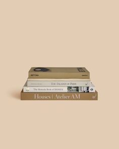 three books stacked on top of each other in front of a beige background with the title house i ateter am