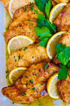 chicken with lemons and parsley on a plate