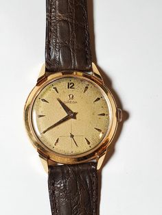 OMEGA Men's 18K Gold cal. 265 Dress Watch 37mm circa 1940's, Swiss -- in perfect condition Vintage Yellow Gold Analog Watch Accessories, Vintage Brown Watch Accessories For Formal Occasions, Vintage Yellow Gold Watch Accessories For Business, Vintage Watch Accessories With Polished Finish For Business, Omega Man, Dress Watches, Watch Vintage, Dress Watch, Wristwatch Men