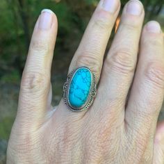 This ring makes a gorgeous statement. The smooth and oval shaped blue turquoise is set in 925 sterling with tribal design details. The back is open to allow energetic contact with the stone. US size 6.75 Bohemian Oval Turquoise Ring Stamped 925, Bohemian Turquoise Oval Ring Stamped 925, Oval Multi-stone Turquoise Ring, Artisan Oval Multi-stone Turquoise Ring, Unique Silver Turquoise Oval Cabochon Ring, Oval Nickel-free Blue Turquoise Ring, Oval Turquoise Multi-stone Ring In Sterling Silver, Grass Valley, Feather Wings