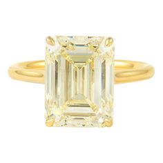 Stunning modern diamond solitaire ring. High jewelry by Alexander Beverly Hills HRD graded 6.02 carat emerald cut diamond, M color grade, and VS2 clarity grade. 18-karat yellow gold, current ring size 6.5. Accommodated with an up to date appraisal by a GIA G.G., please contact us with any questions. Thank you. HRD Report Number 180000169503 Item Number APC1112 Luxury Yellow Gold Emerald Cut Crystal Ring, Modern Emerald Ring With Gia Certified Diamond, Modern Gia Certified Emerald Ring With Diamond, Modern Gia Certified Emerald And Diamond Ring, Yellow Emerald Cut Diamond Ring, Luxury Emerald Ring With Single Diamond, Yellow Gold Octagon Emerald Ring With Diamond, Octagon Brilliant Cut Emerald Ring In Yellow Gold, Yellow Gold Emerald Ring With Brilliant Octagon Cut