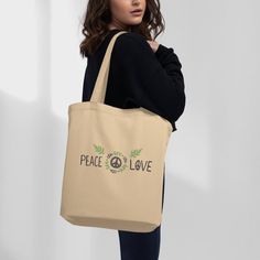 This aesthetic shoulder bag is made of strong, organic fabric and looks great. It has two straps that make it easy to carry, and it can be used as a cool purse, canvas lunch bag, and a canvas makeup bag. You can take it with you when you go to work, school, or even when you have a picnic in the park. It's perfect for a day at the beach too! You can put your towel, sunscreen, sunglasses, and a book inside.   It makes a fantastic book lover gift or can be used as a knitting bag.  The best part is that this bag is good for the environment. Instead of using plastic bags that we throw away, this bag can be used over and over again. It's made from organic cotton, which means it's grown without bad chemicals. Farmers use natural things to help the cotton grow and keep bugs away. When you use this Organic Tote Bag For Everyday, Organic Everyday Tote Bag, Everyday Organic Tote Bag, Organic Canvas Rectangular Bag, Organic Rectangular Canvas Bag, Recyclable Canvas Shoulder Bag For Everyday Use, Everyday Beige Canvas Bag With Eco-friendly Ink, Recyclable Canvas Shoulder Bag For Daily Use, Organic Tote Bag For Daily Use