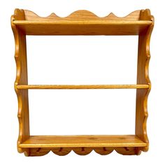 a wooden shelf with two shelves on each side and scalloped edges, isolated against a white background