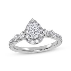 a pear shaped diamond engagement ring on a white background