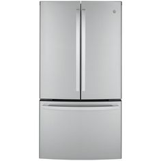 a silver refrigerator freezer sitting on top of a white wall