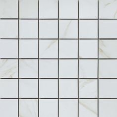 a white tiled wall with black lines on it