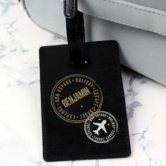 This Personalised Stamped luggage tag is a stylish and unique way to ensure you can always locate your luggage in a busy airport. Personalise this tag with a name up to 12 characters long. Personalisation will appear in fixed upper case. Luggage tag fastens with a secure buckle and is ideal for attaching to the handle of a suitcase, rucksack or handbag. The tag also features a discreet identification window. The material of this luggage tag is leather. Please note, as this is a natural product, there may be some very slight variance in the colour of the leather. Ideal for Her, Christmas, Birthdays, Children, Travel and Holidays. Black Luggage, Special Symbols, Travel Luggage Tag, Leather Stamps, Leather Luggage Tags, Leather Luggage, Personalized Tags, Upper Case, Luggage Accessories