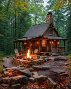 a small cabin in the woods with a fire pit