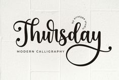 the word thursday written in cursive type on a white brick wall