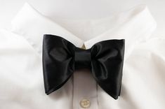 "Black tie event Bow tie, Oversized Bow tie, Tom ford style, Silk black bowtie New Way Creation Design pre tied and adjustable silk handmade bowtie Color: Black & other option - please see before checkout. Fabric type: Satin Silk (shiny) Dimension: 1. Adult size: 4.75/3.15\" (12 / 8 cm), 2. Child size: 3.95/2.36\" (10/6 cm) or 3. Infant size: 3.15/1.57\" (8/4 cm) Adjustable strap: yes, up to 18\" aprox (for adult). Please let me know if you need it longer We offer free of charge custom initi Black Standard Tie With Bow, Black Bow Tie With Bow Tie Back, Classic Black Ribbon Bow Tie For Formal, Dapper Black Bow With Ties, Classic Black Bow For Black Tie Event, Classic Black Ribbon Bow Tie For Wedding, Black Detachable Bow Tie For Business, Classic Black Bow Suit And Tie Accessories, Classic Black Bow For Business