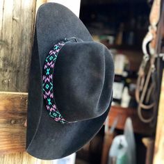 This hand-beaded hatband is the perfect accent to your favorite straw, felt, or fashion hat! This piece is so versatile, it can be worn as a necklace, headband, or even a wrap bracelet!  -1in wide  -Fits hat size 6 7/8 and up -Handmade with matte black, turquoise/teal, purple, and metallic gunmetal glass beads -Finished with black deer buckskin leather and tie Handmade on the Central Coast of California Black Beaded Western Hat, Adjustable Felt Fedora With Flat Crown, Adjustable Felt Fedora Hat Bands, Adjustable Felt Hat Band For Fedora, Adjustable Flat Crown Felt Fedora, Adjustable Felt Hat With Flat Crown, Adjustable Flat Crown Fedora In Felt, Bohemian Adjustable Felt Hat, Adjustable Flat Crown Felt Hat