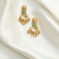 Description: Step into elegance with our antique chandbali earrings, featuring delicate green kempu stones set in vintage antique gold plating. With timeless charm and exceptional craftsmanship, these earrings are perfect for adding a sophisticated touch to any outfit. Details & Specifications: Materials used: Brass Alloy with Antique Gold Platting Weight - 11.75 gm Length - 4 cm Make it custom: Want to make it a custom Earrings? Sure! Reach out to us at support@tarinika.com and we’ll be happy t Brass Chandbali Bridal Earrings, Traditional Green Brass Earrings, Elegant Green Chandbalis With Latkans, Festive Brass Chandbalis With Matching Earrings, Brass Temple Jewelry Chandbalis Drop Earrings, Traditional Green Hoop Earrings For Festive Season, Ornate Chandbalis For Diwali, Elegant Green Chandbalis With Intricate Design, Festive Green Chandbali Hoop Earrings