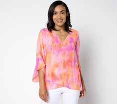 Hearts flutter and eyes follow as you breeze by in this romance-ready blouse from BEAUTIFUL by Lawrence Zarian. Pairing dreamy Georgette fabric with pretty prints and stunning color combos, this timeless piece puts together a featherweight feel, flattering silhouette, and feminine details (we're loving the delicate crossover designs on the high-low sleeves and hem!).  Arriving in time for summer, this party-perfect top carries you through a season's worth of social events, weekend getaways, and Flowy Feminine Multicolor Top, Feminine Flowy Multicolor Top, Feminine Multicolor Flowy Top, Feminine Details, Strappy Sandals Heels, Pink Tie Dye, Georgette Fabric, Pretty Prints, V Neck Blouse