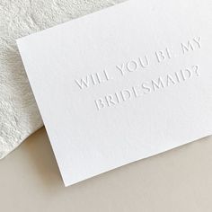 two white cards with the words will you be my bridesmaid? on them