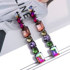 Colorful crystal longline drop-dangle earrings are simply stunning! Add to any look for any extra splash of color. Available in 9 different colors. Details Item Type: Fashion Earrings Metal Type: Zinc Alloy Material: Glass/Rhinestone Size: 8.5*1.0cm Back Finding: Push Back Eclectic Chic, Geometric Crystal, Popular Earrings, Y2k Accessories, Rhinestone Clutch, Wedding Party Jewelry, Long Drop Earrings, Long Dangle Earrings, Black Earrings